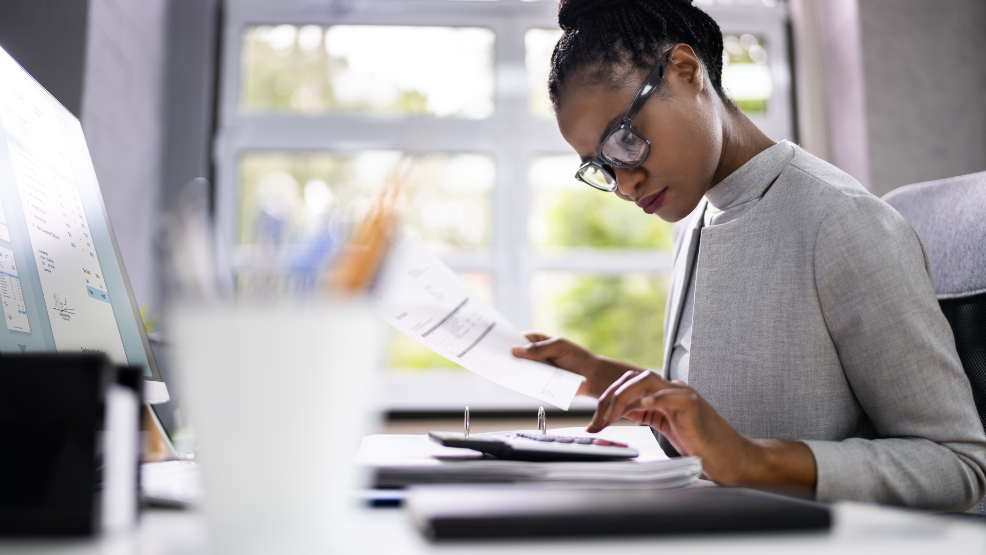 Tax Edge consultant reviewing accounting documents and calculations